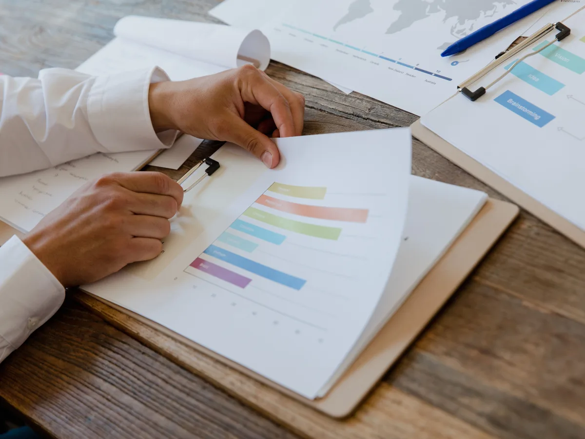 Working through a business case document with a pen