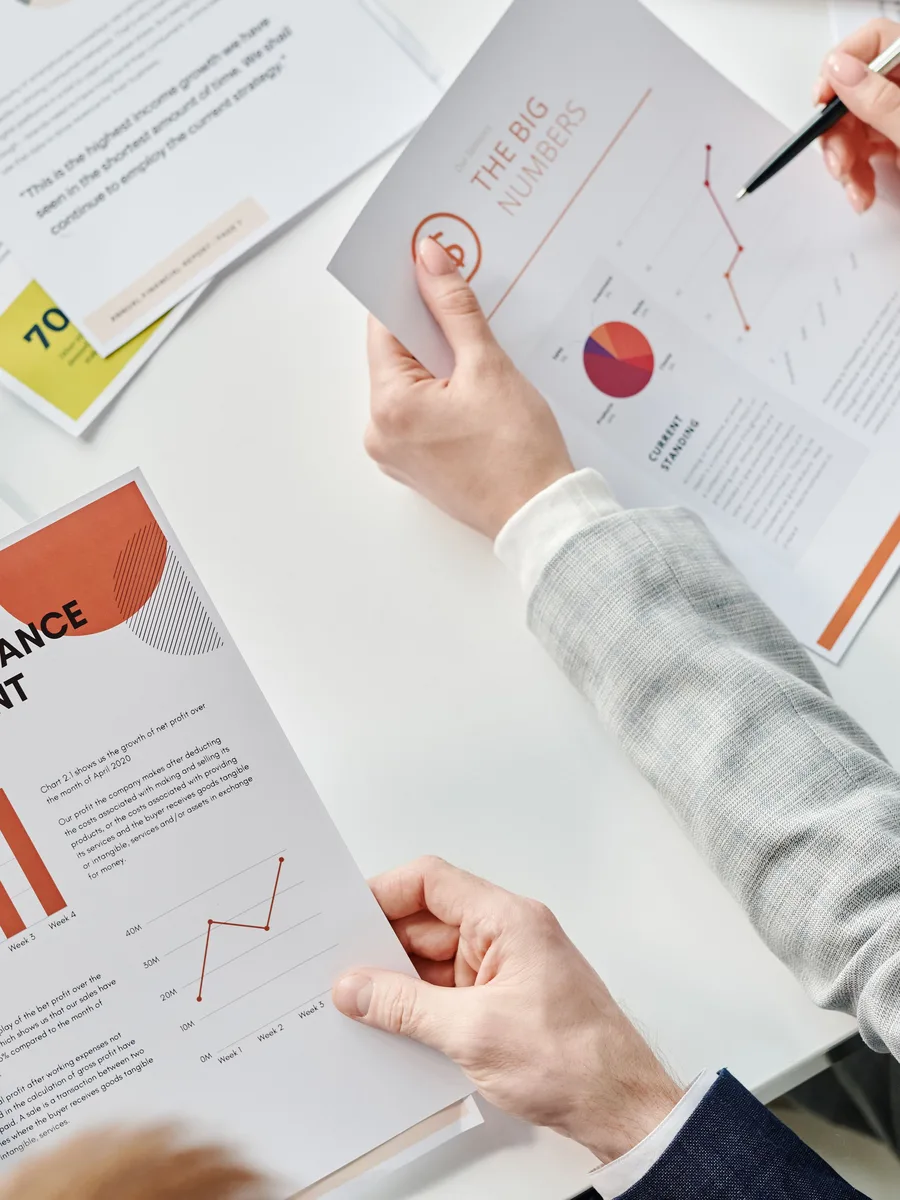 Reviewing a printed performance report with charts